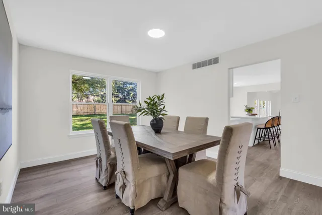 a kitchen with stainless steel appliances a stove a microwave a sink and cabinets