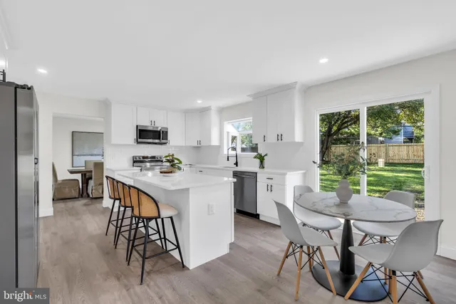 a living room with furniture fireplace and flat screen tv