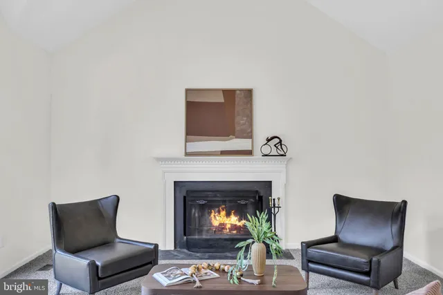 a spacious bedroom with a bed a couch and a window