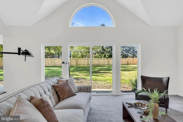 a bathroom with a double vanity sink a toilet a bathtub and shower