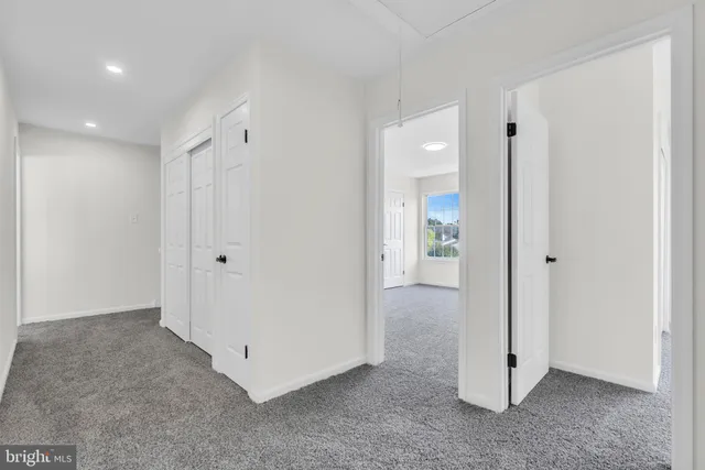 a view of an empty room with a garage