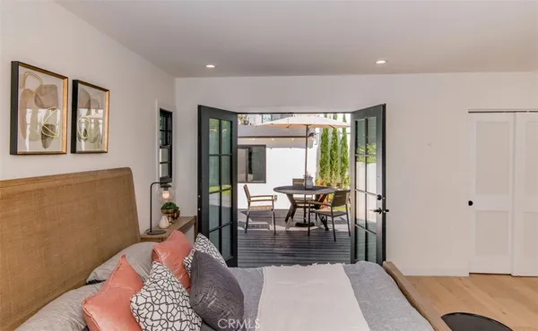 a living room with furniture a window and a table