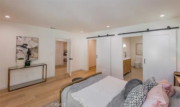 a bedroom with a bed and a couch
