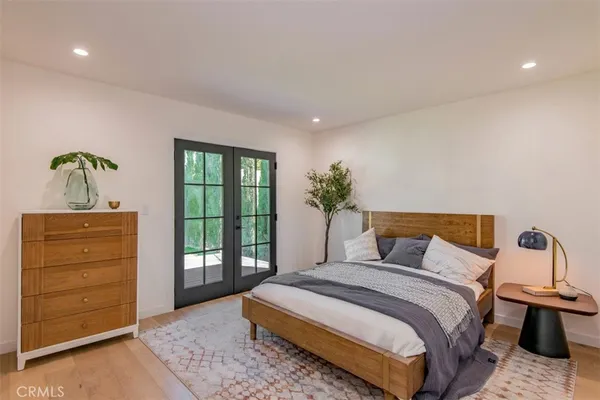 a bedroom with a bed and with furniture