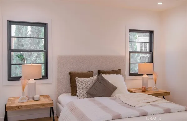 a bedroom with a bed and window