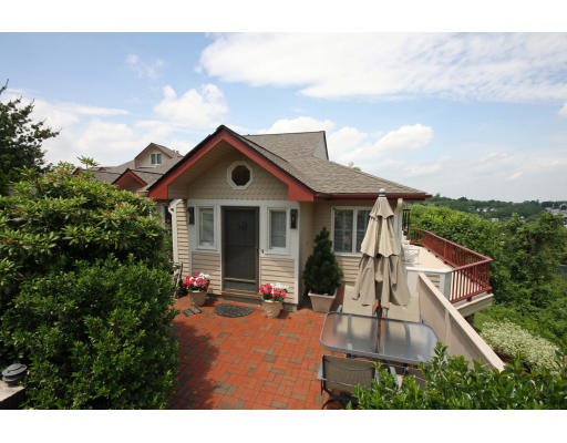 79 Algonquin Road, Unit 79 Newton, MA 02467 - Photo 1 of 1 a aerial view of a house with a yard and potted plants