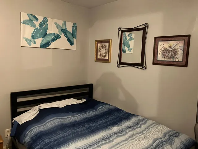 a close up of a bed in a room