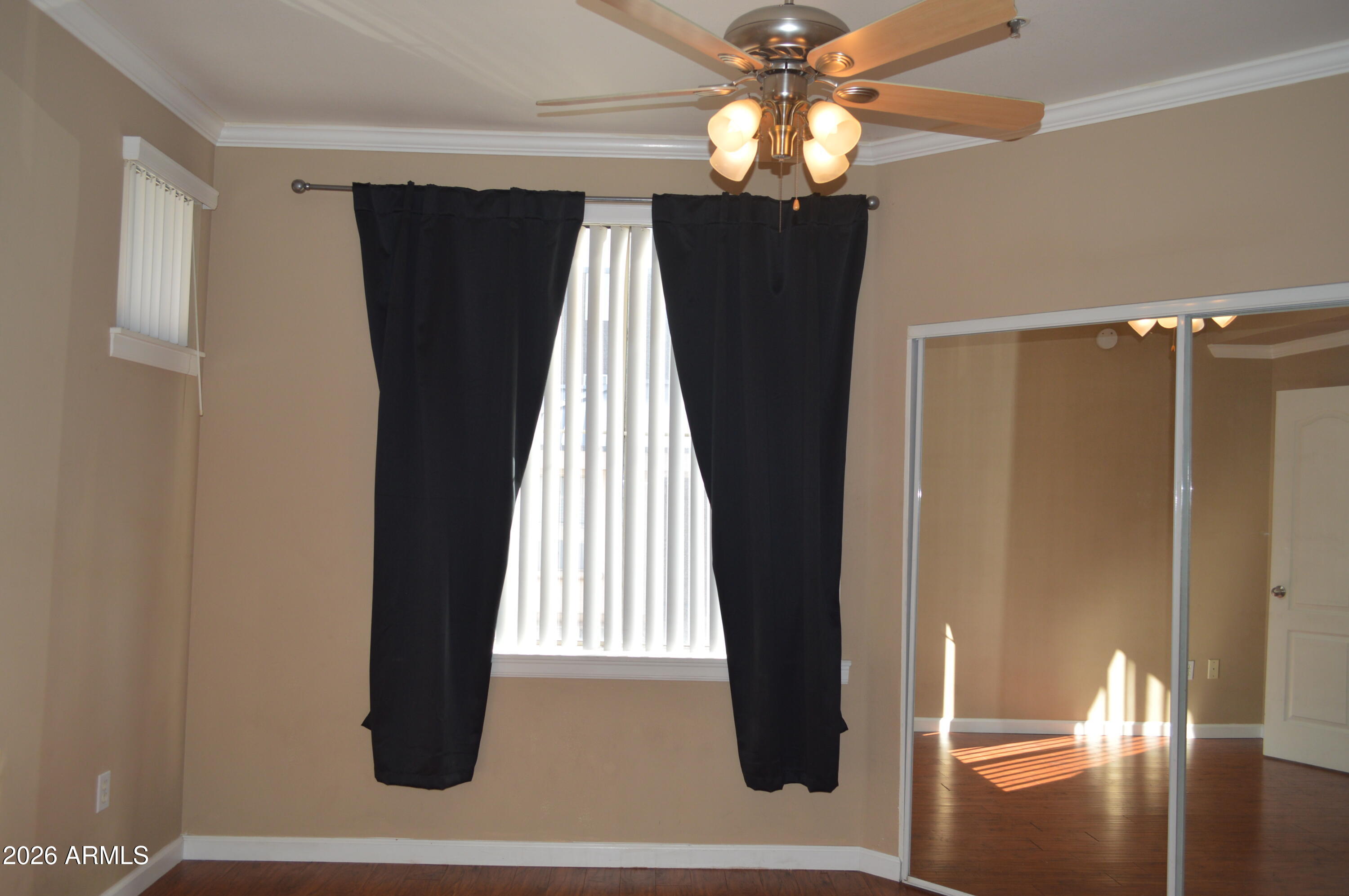1701 East Colter Street, Unit 361 Phoenix, AZ 85016 - Photo 16 of 68 a view of a bedroom with windows and ceiling fan
