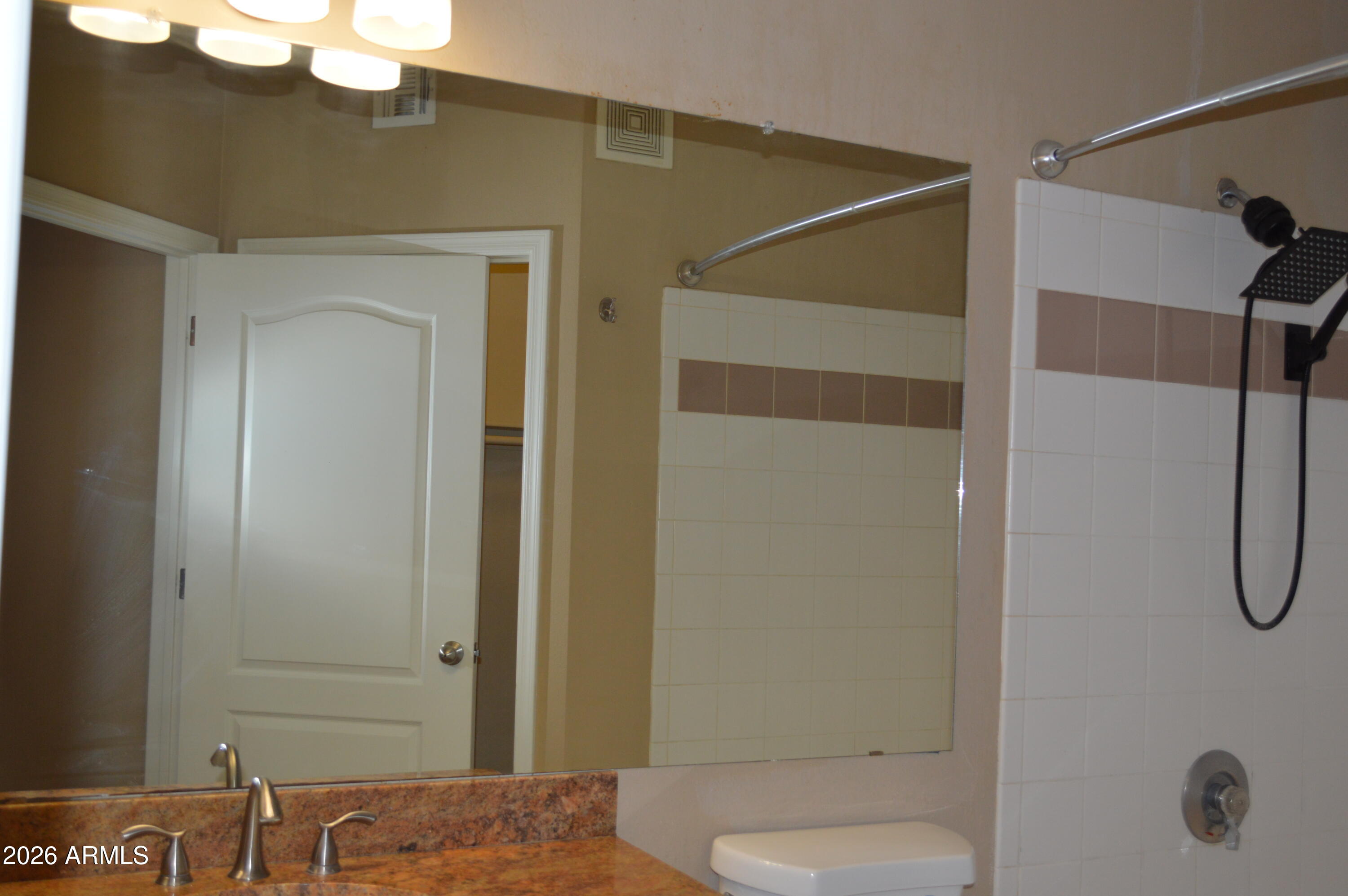 1701 East Colter Street, Unit 361 Phoenix, AZ 85016 - Photo 28 of 68 a bathroom with a shower and a toilet