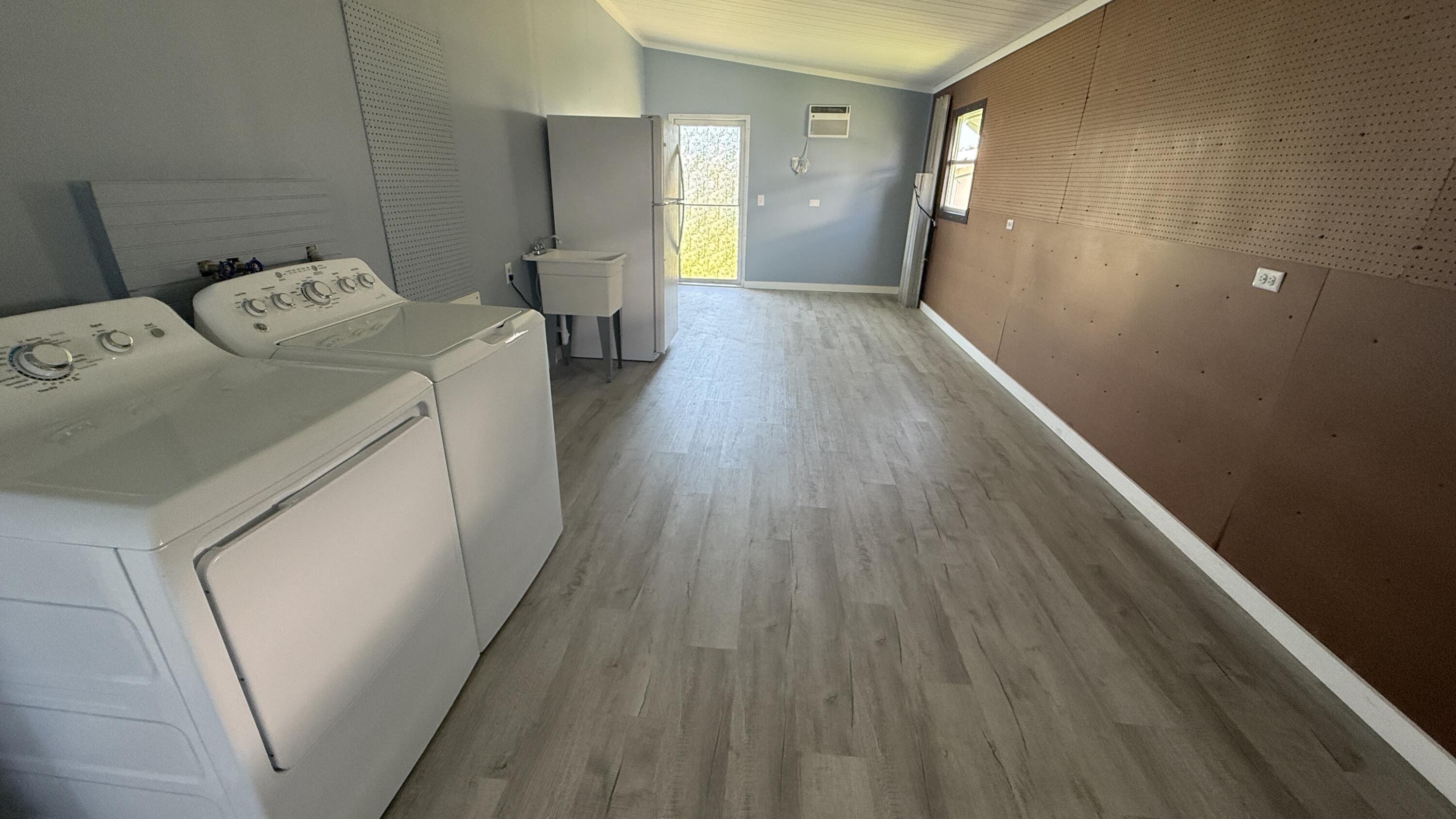 6919 Southeast Congress Street Hobe Sound, FL 33455 - Photo 28 of 52 a view of empty room with wooden floor