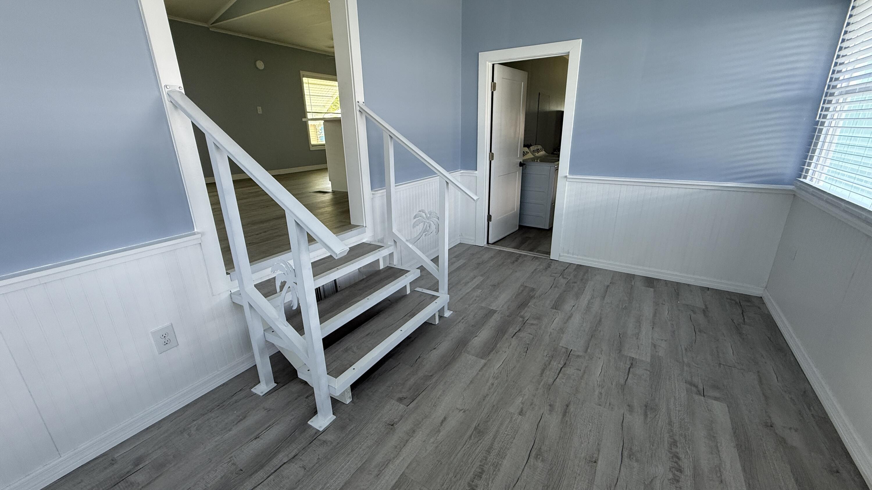 6919 Southeast Congress Street Hobe Sound, FL 33455 - Photo 3 of 52 a view of entryway with wooden floor