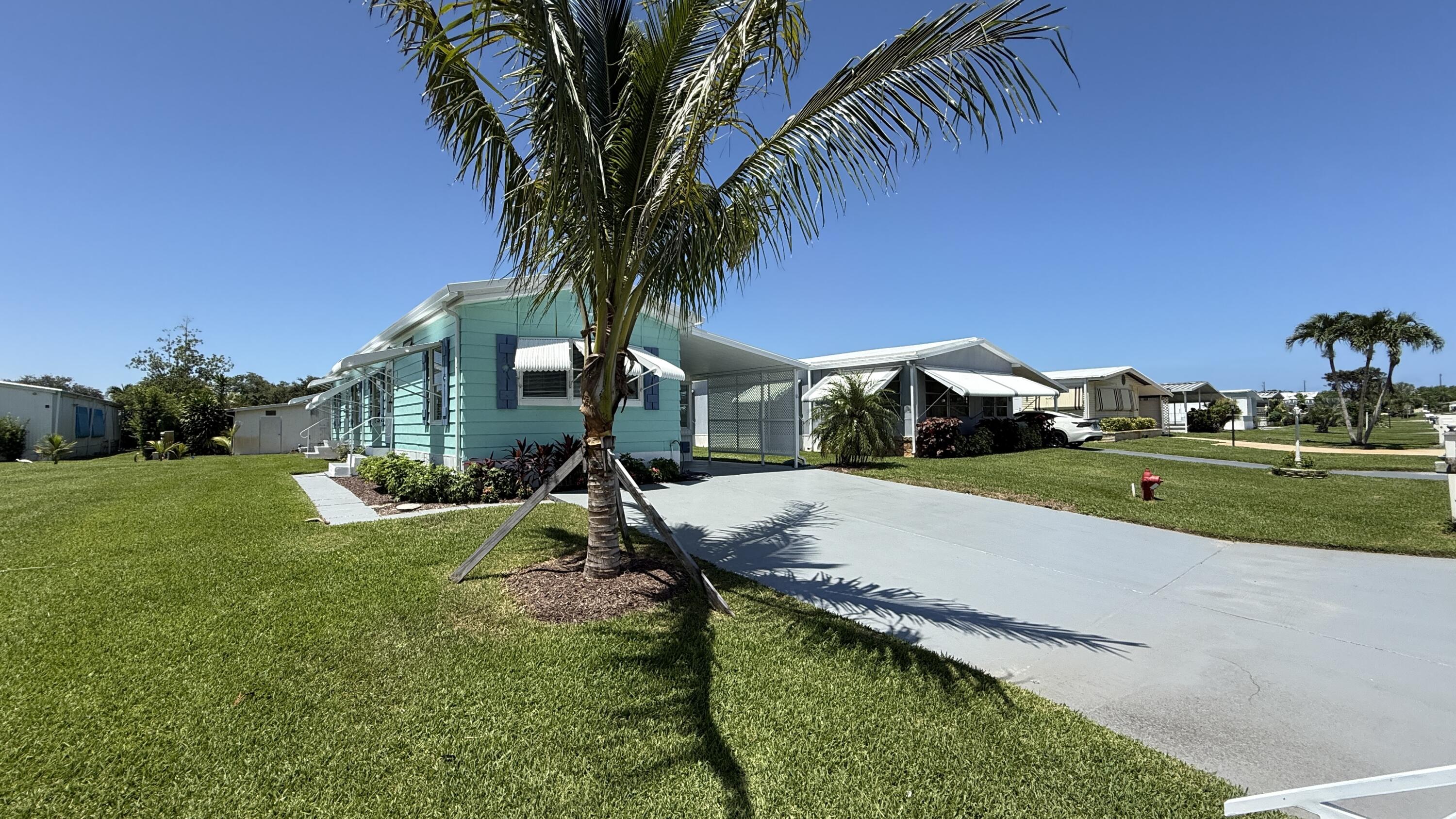 6919 Southeast Congress Street Hobe Sound, FL 33455 - Photo 33 of 52 a view of a garden