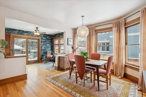 a view of a dining room with furniture window and wooden floor
