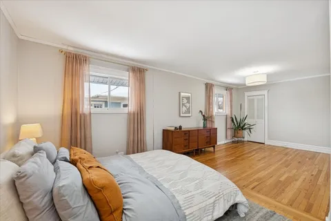 a bedroom with a bed and a table in it