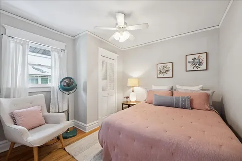 a bedroom with a bed and chair