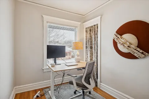 a workspace with furniture and window