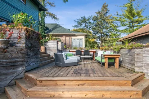 a view of a backyard with sitting area