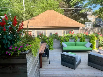 a backyard of a house with lots of green space and seating area