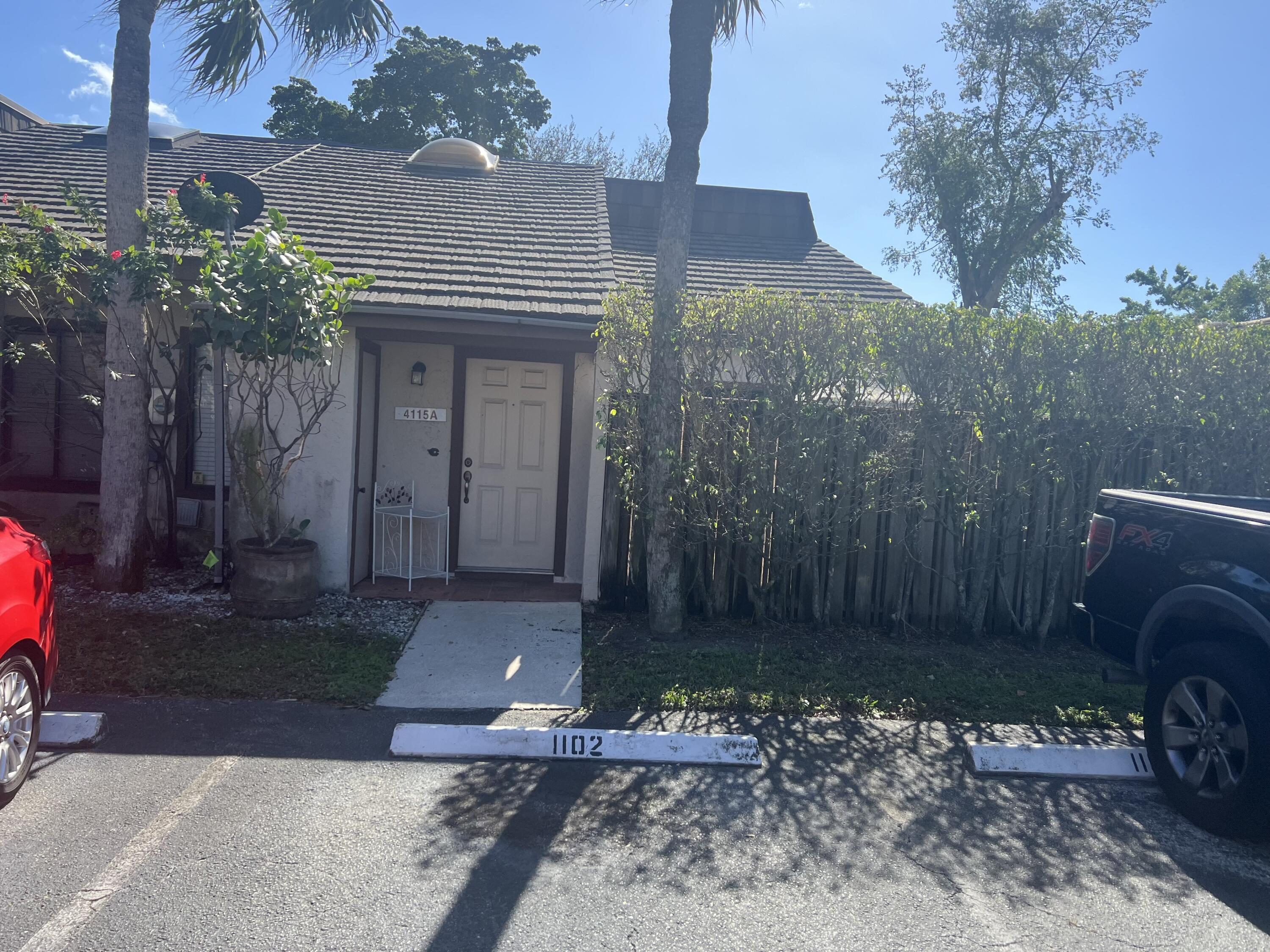 4131 Palm Bay Circle, Unit C West Palm Beach, FL 33406 - Photo 1 of 1 a front view of a house