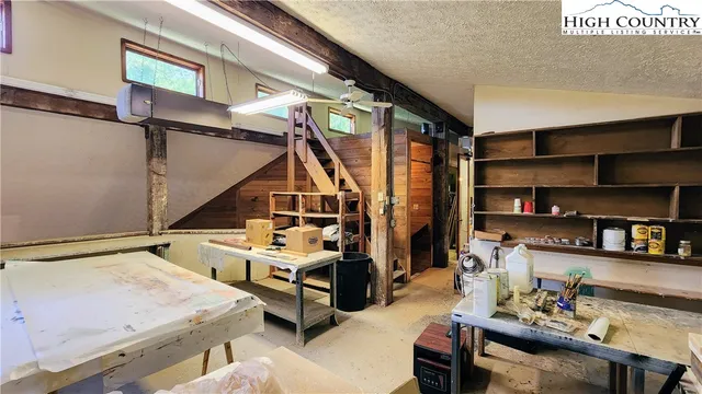 a view of a workspace with furniture