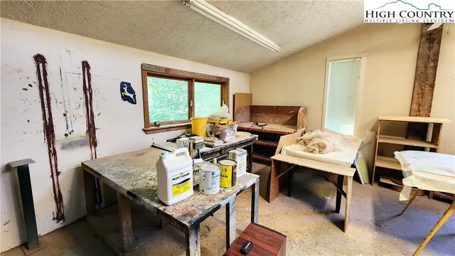 a large room with furniture and a flat screen tv