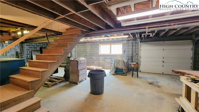 a view of a patio with table and chairs