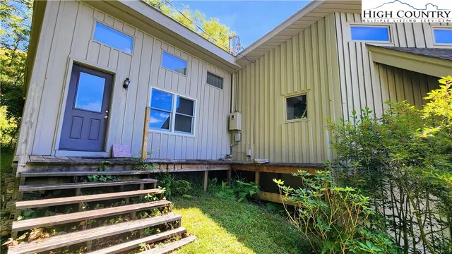 a balcony with table and chairs