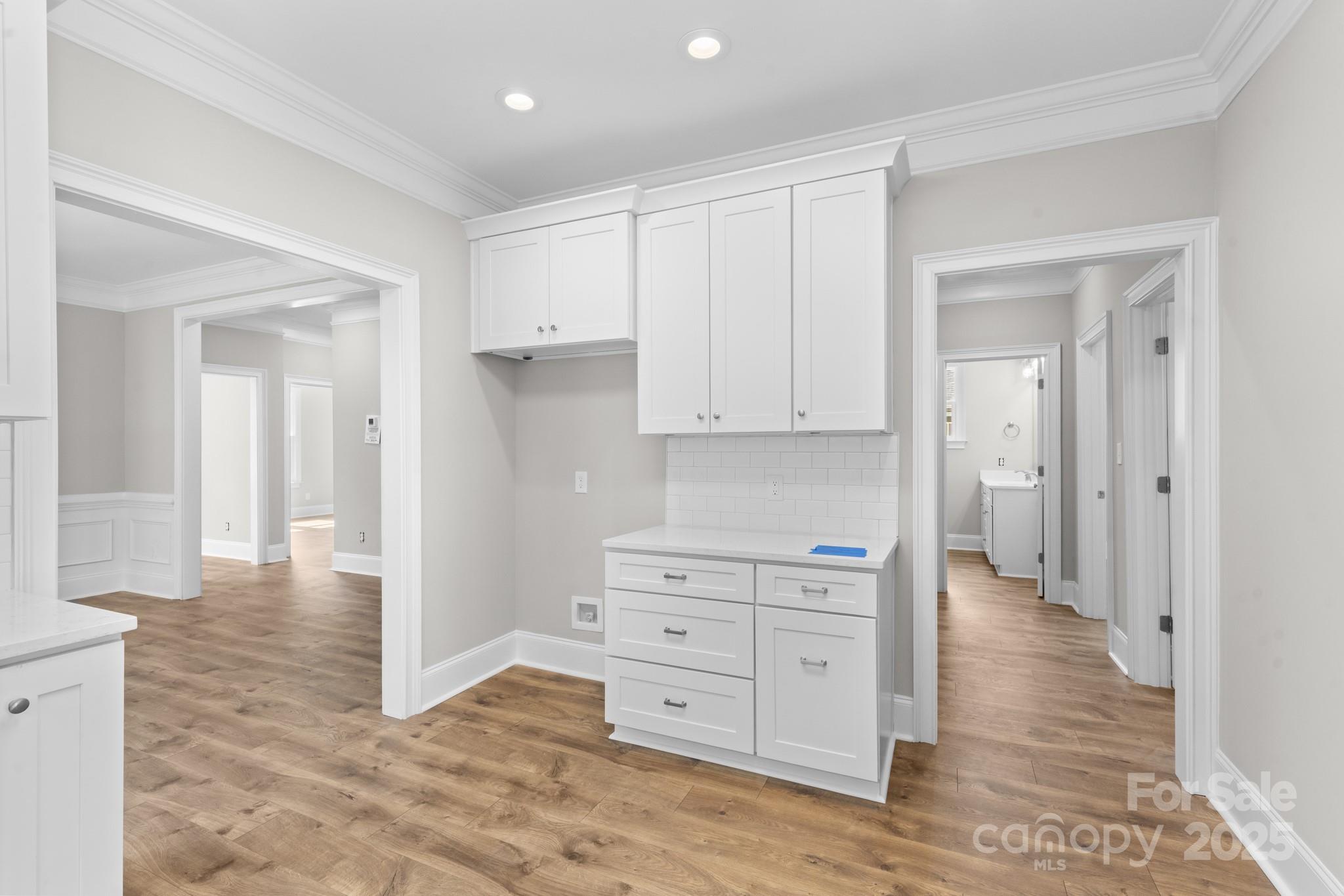 302 West Gay Street Lancaster, SC 29720 - Photo 11 of 26 a view of a hallway with wooden floor