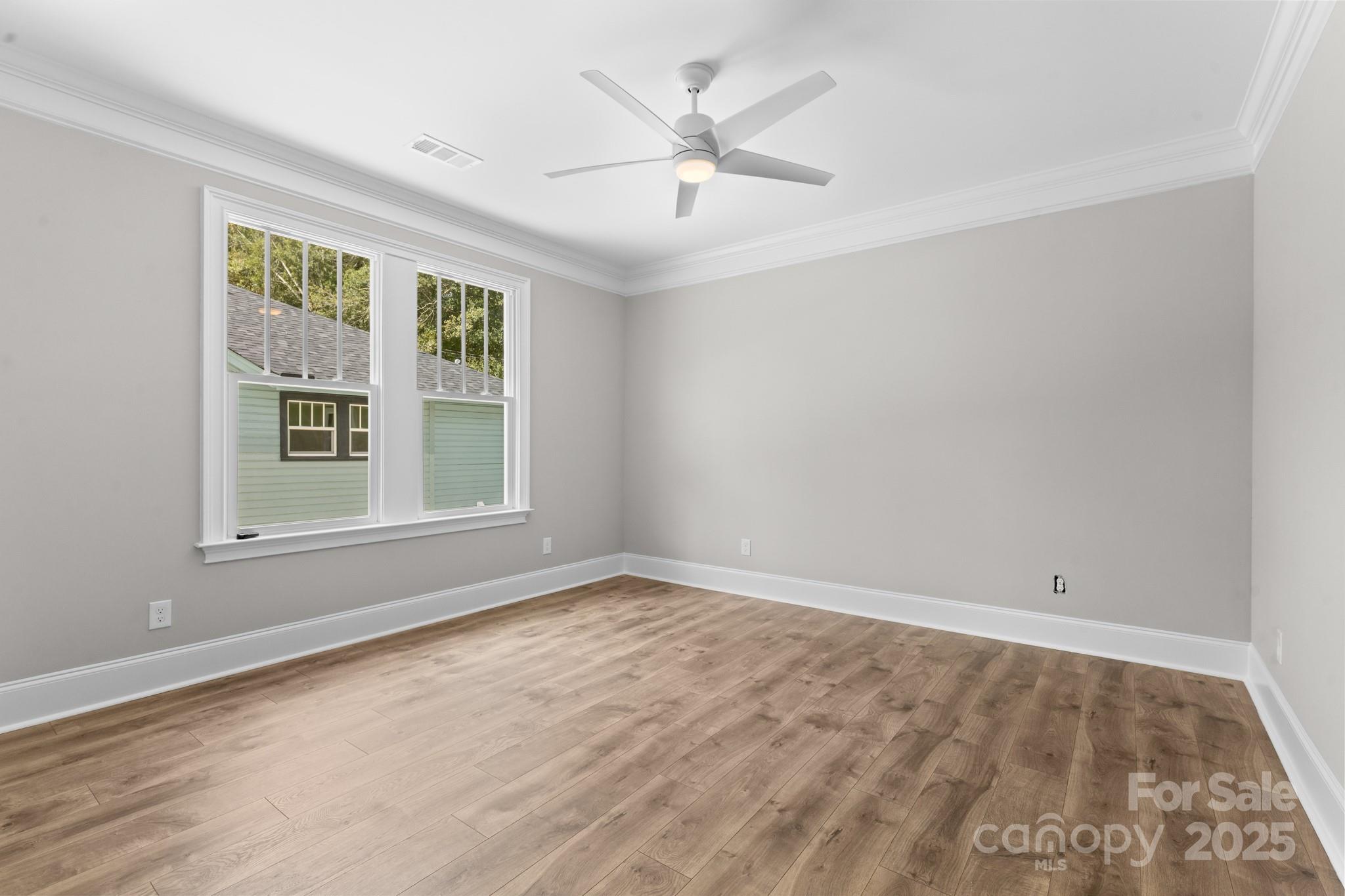 302 West Gay Street Lancaster, SC 29720 - Photo 13 of 26 wooden floor in an empty room with a window