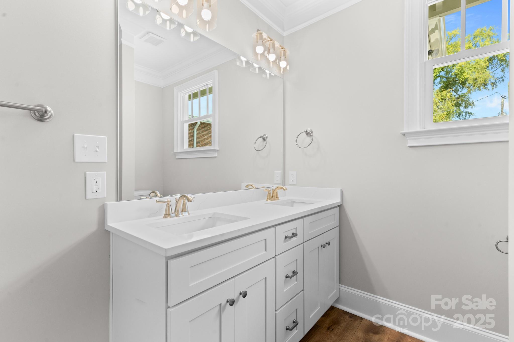 302 West Gay Street Lancaster, SC 29720 - Photo 15 of 26 a bathroom with a sink a vanity and a mirror
