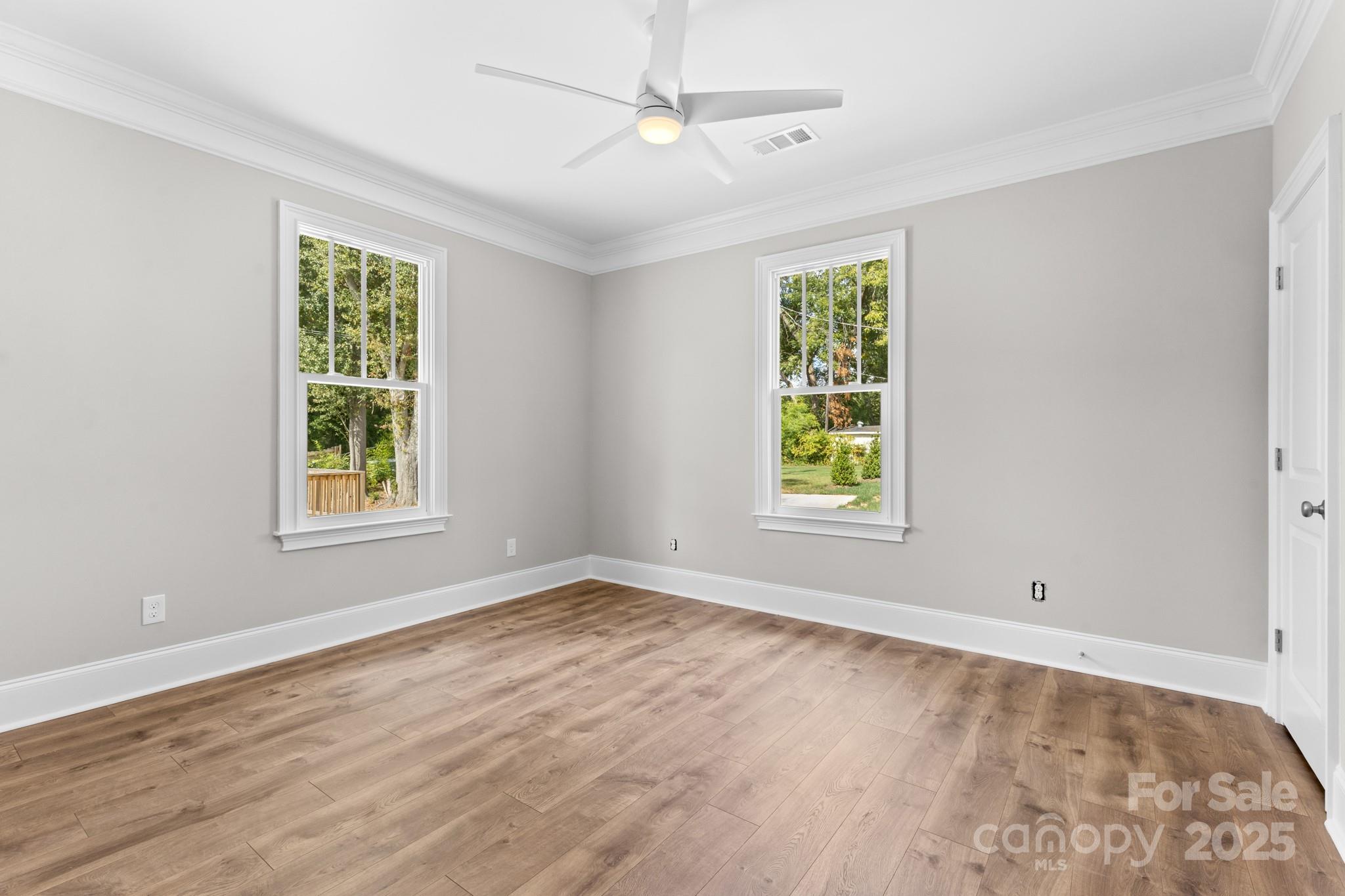 302 West Gay Street Lancaster, SC 29720 - Photo 16 of 26 a view of an empty room with wooden floor and a window