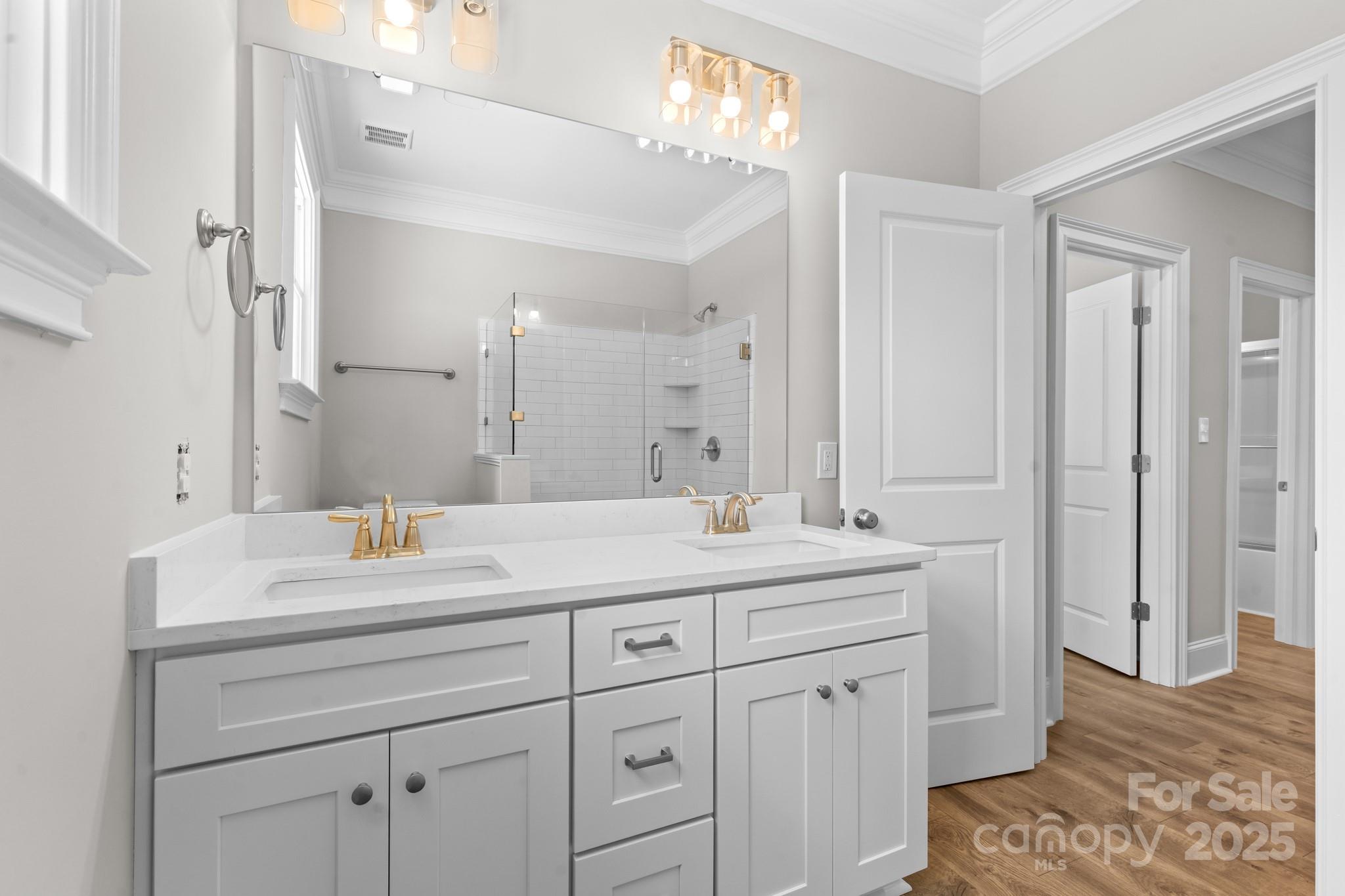 302 West Gay Street Lancaster, SC 29720 - Photo 18 of 26 a spacious bathroom with double sink a mirror a and a shower