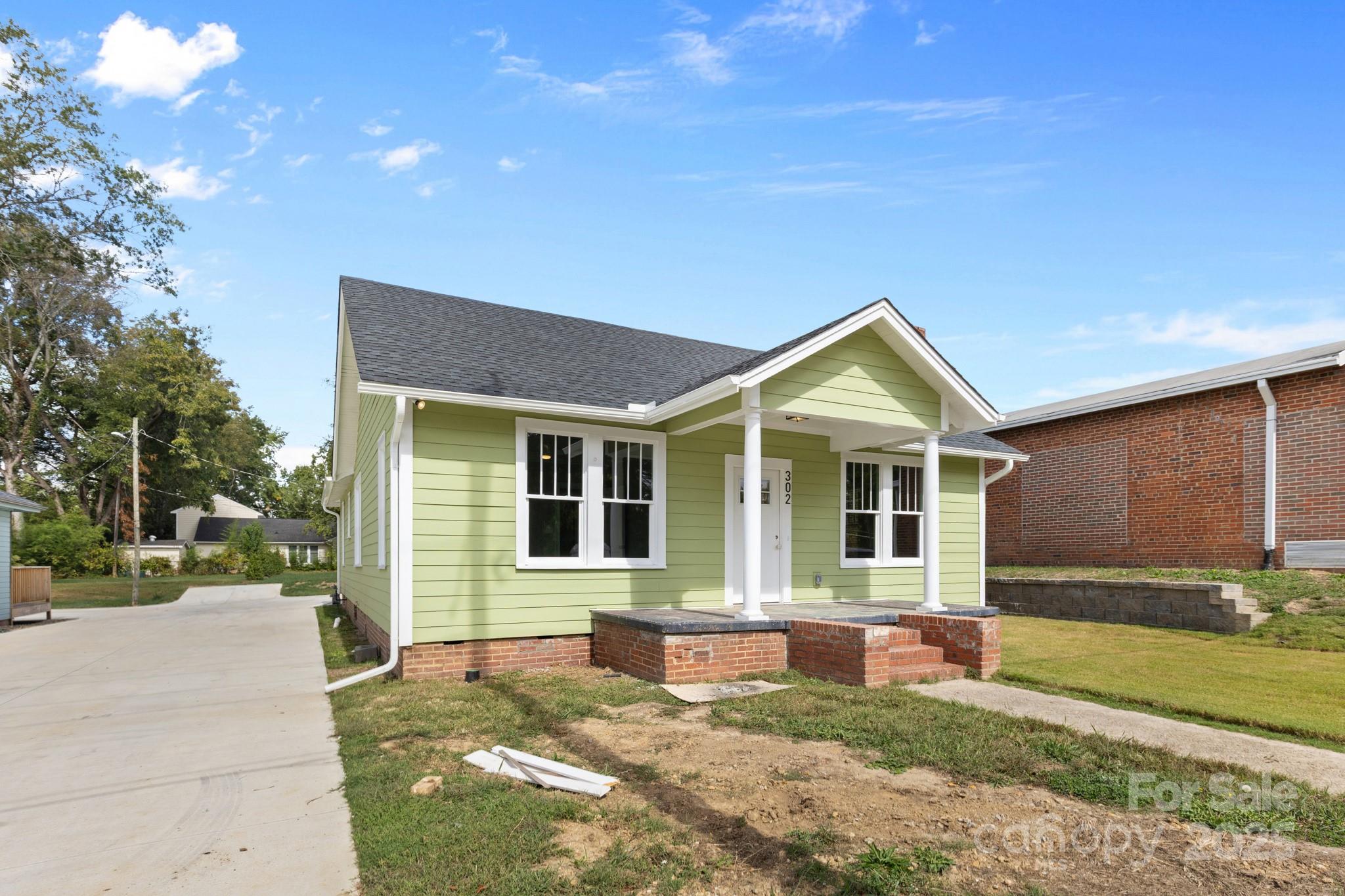 302 West Gay Street Lancaster, SC 29720 - Photo 3 of 26 a view of a house with a yard and large tree