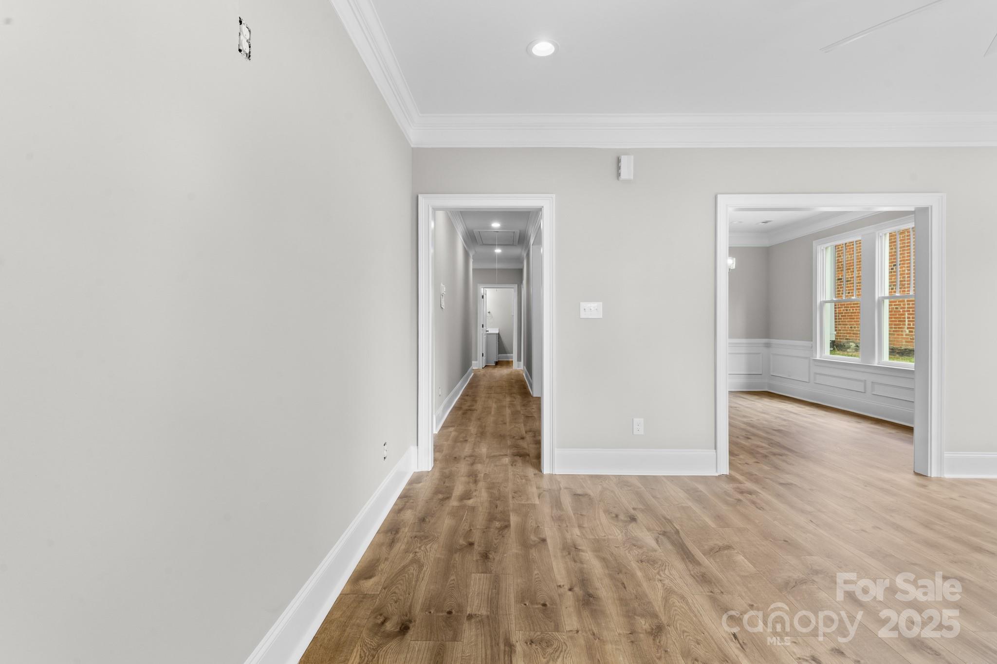 302 West Gay Street Lancaster, SC 29720 - Photo 4 of 26 wooden floor in a hall with an entryway