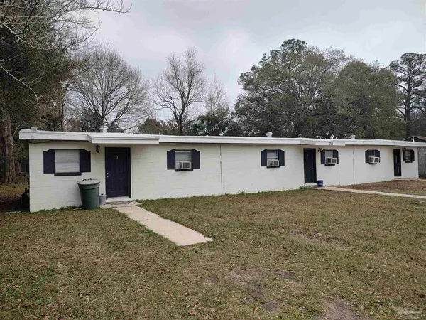 front view of a house with a yard