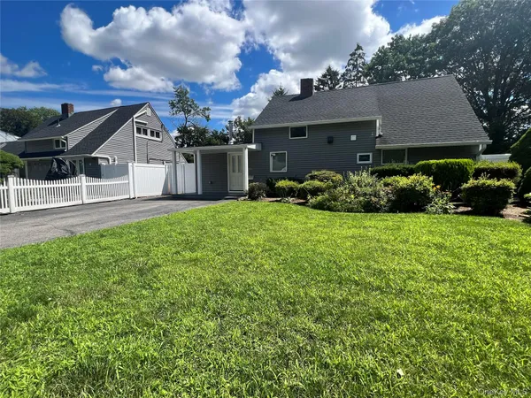 front view of a house with a yard