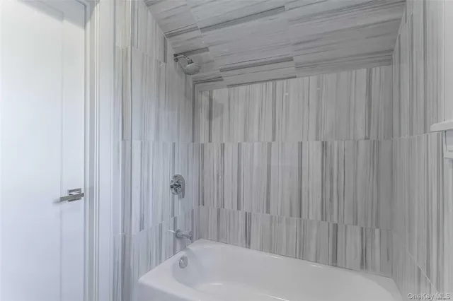 a bathroom with a sink a toilet and tub