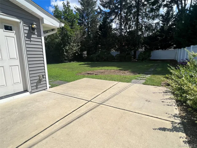 a view of storage and utility room with two washing machine