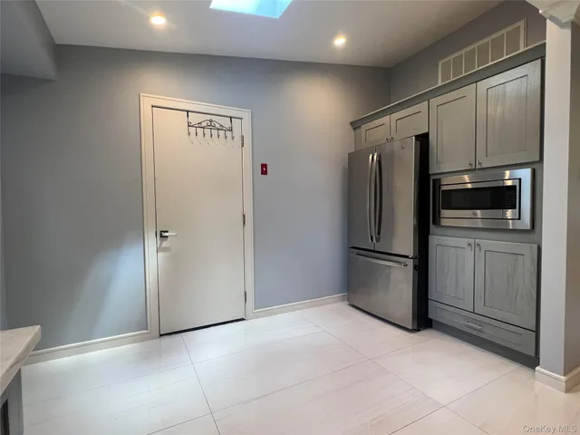 a view of an empty room and fire place