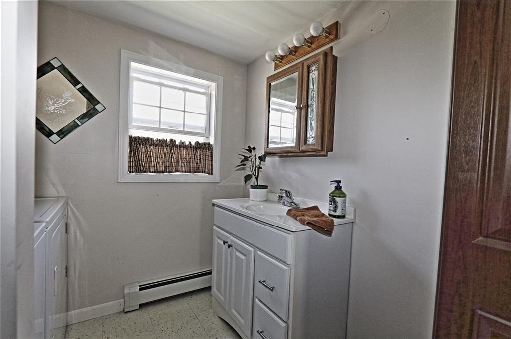 large bathroom on upper level with...