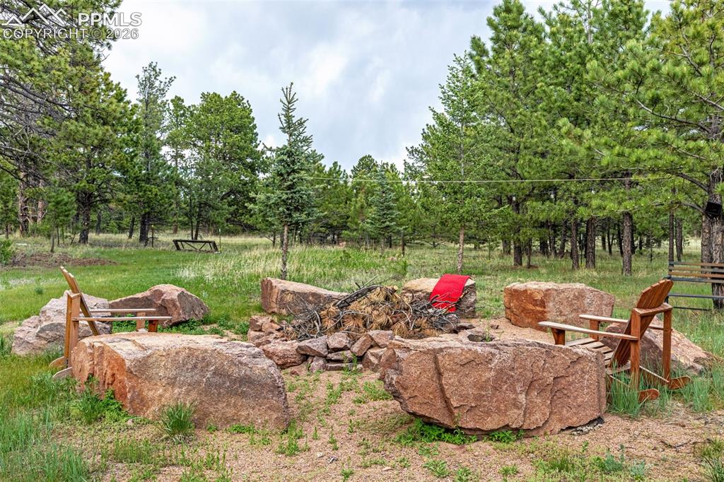143 Ring Road Guffey, CO 80820 - Photo 34 of 36 Firepit with solar cafe lights