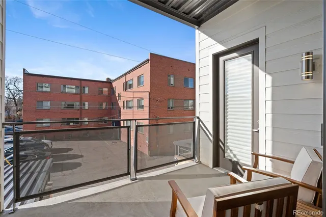 a view of a balcony with chairs
