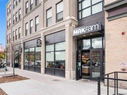 a view of a building with retail shops