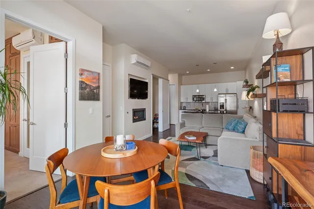 a bedroom with a bed next to a window