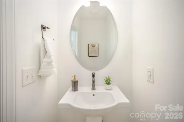 a bathroom with a sink and mirror