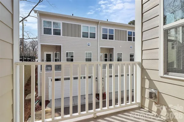 a kitchen with stainless steel appliances granite countertop a sink a stove a refrigerator and a window