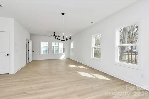 a view of a room with a ceiling fan