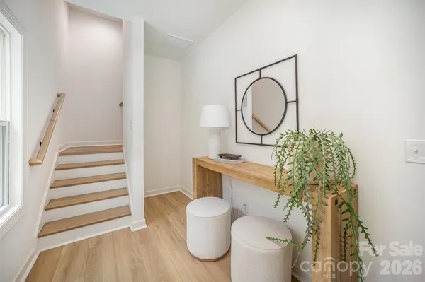 a bathroom with a toilet sink vanity and mirror