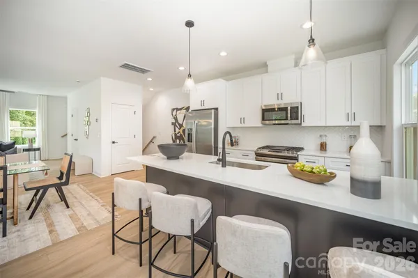 a kitchen with a sink cabinets and window