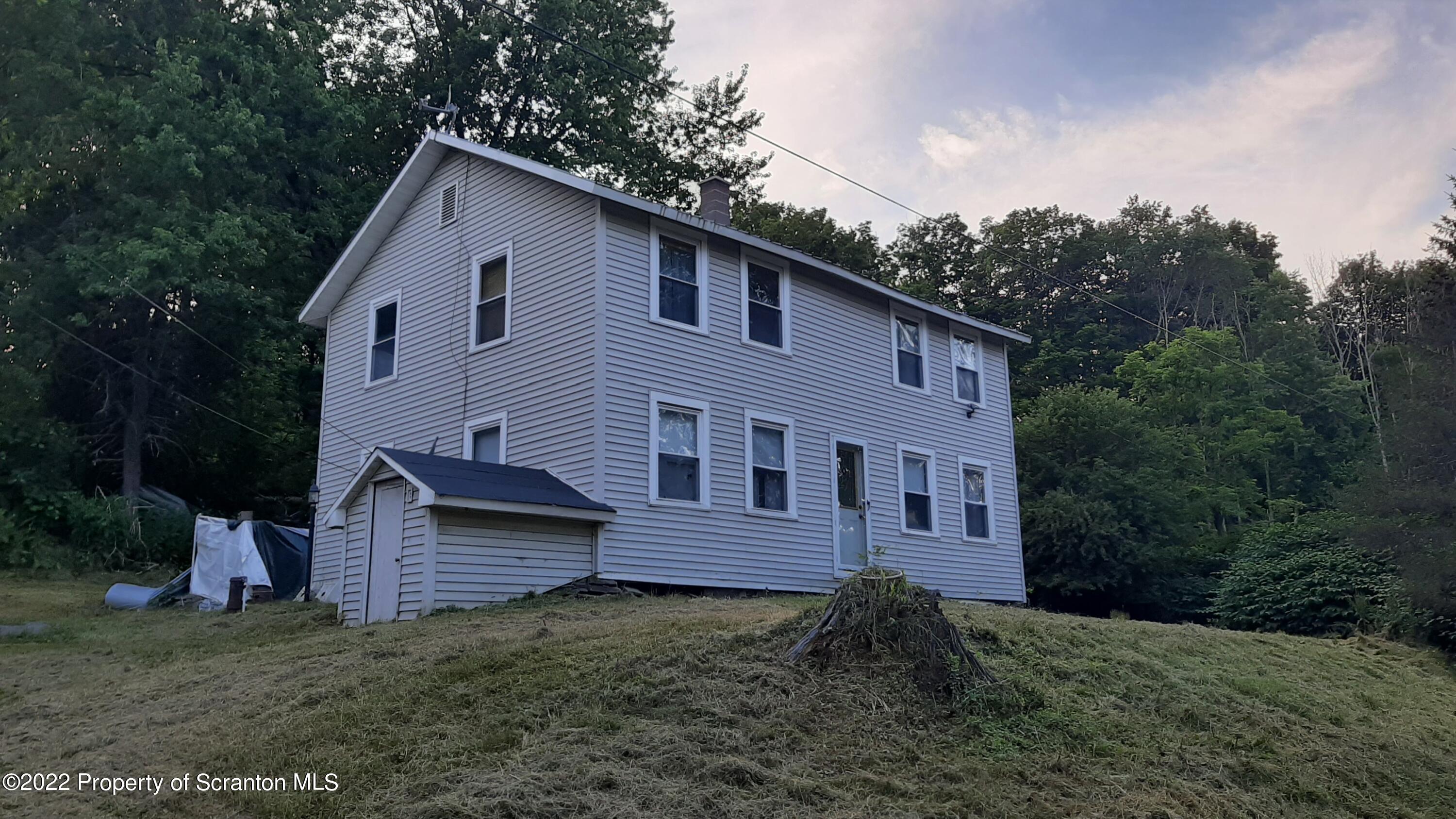469 Bennett Road Hop Bottom, PA 18824 - Photo 1 of 25 a view of a house with a yard